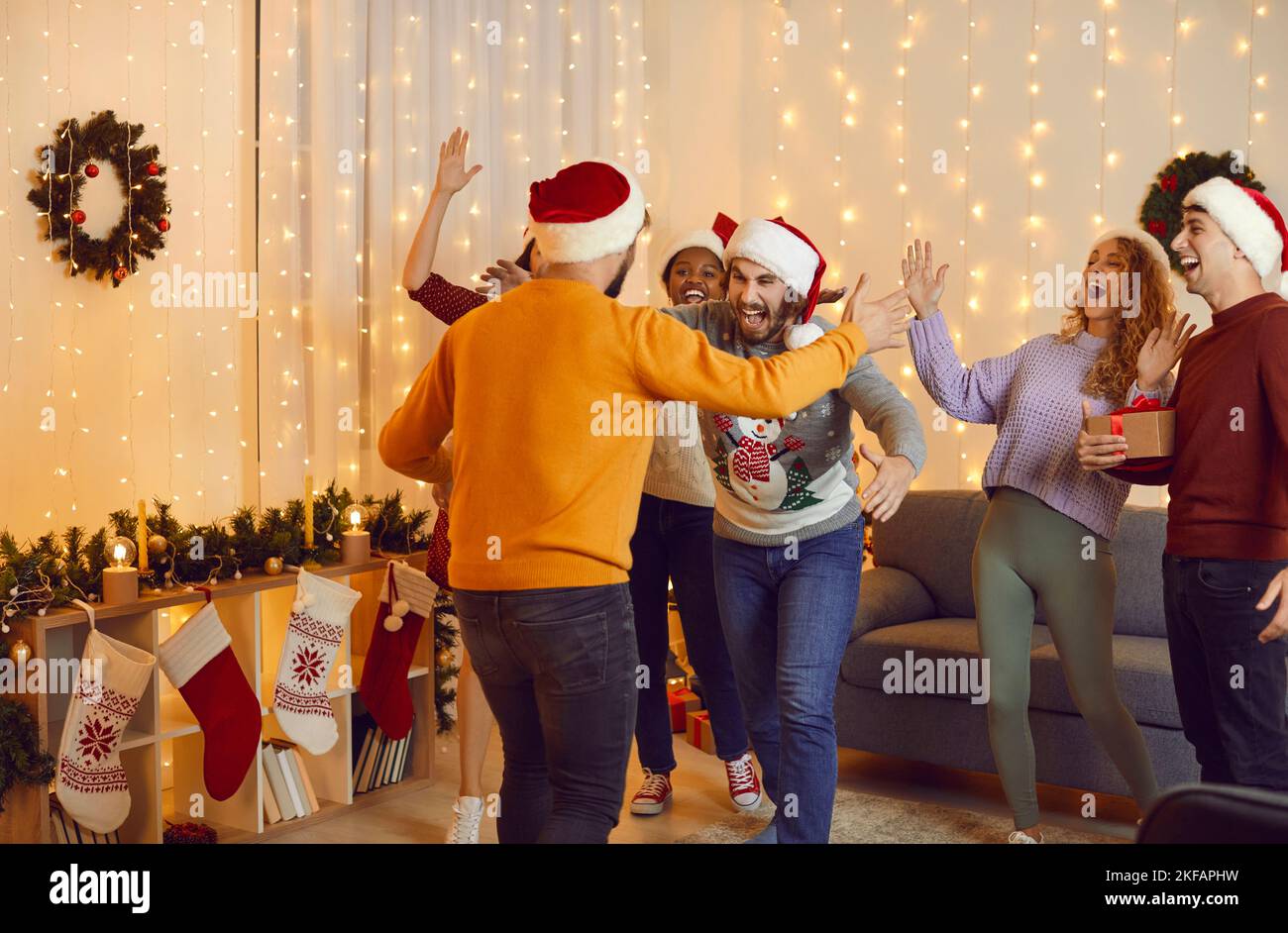 Overjoyed multiracial people celebrate Christmas at home Stock Photo