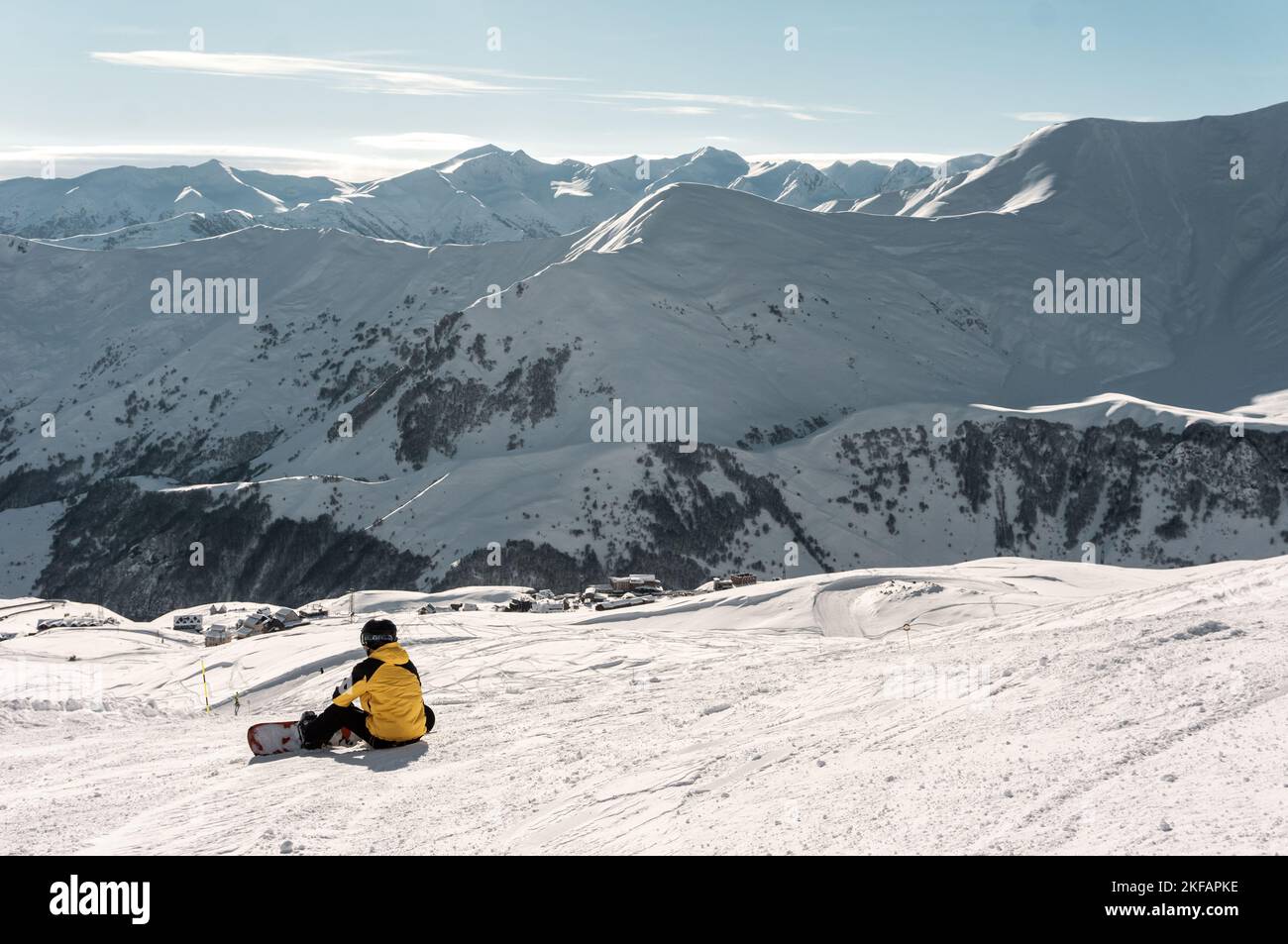 snowboarder have rest on slope, ski and snowboarding at winter mountain on track Stock Photo