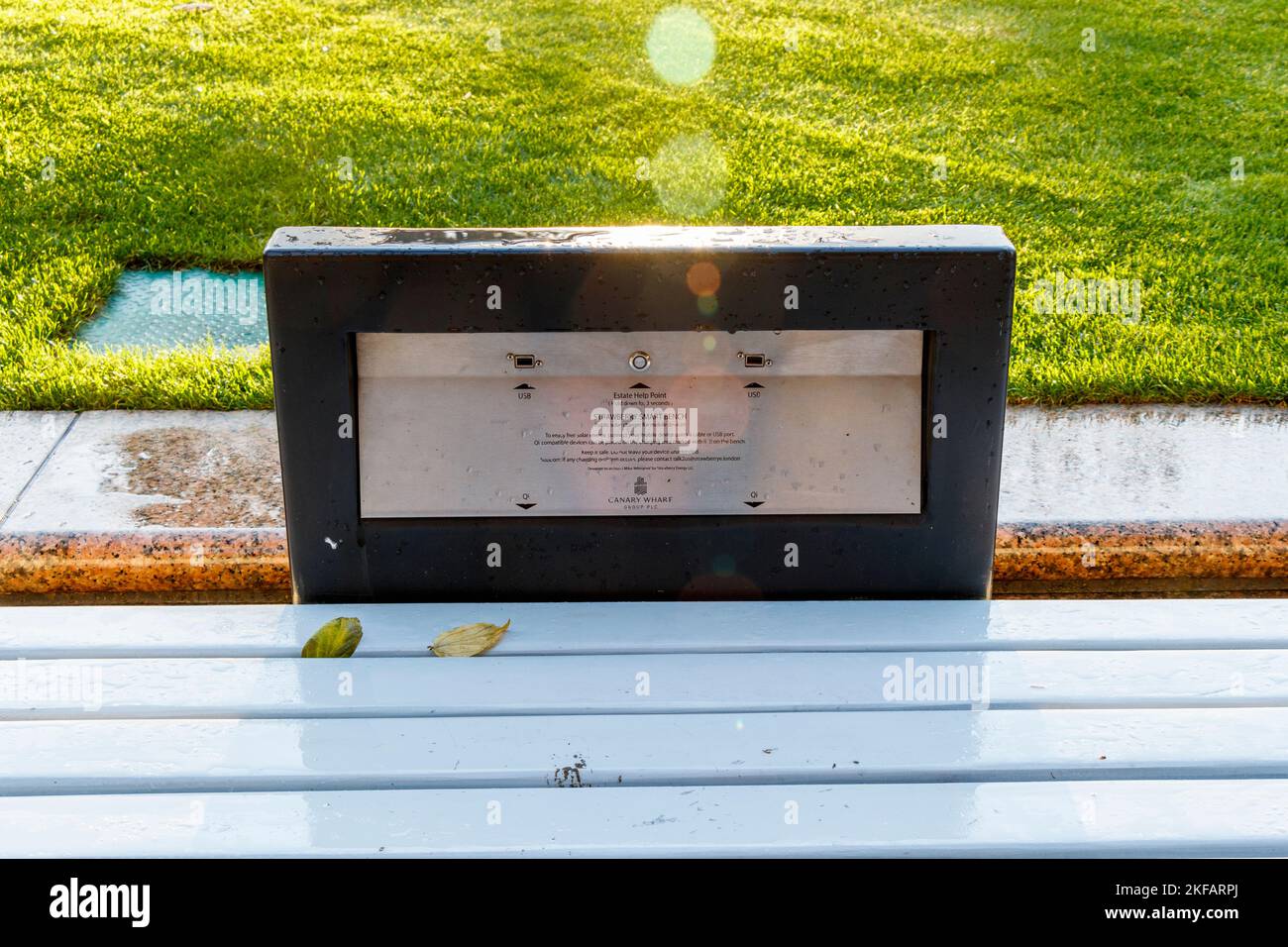 A Strawberry Smart Bench, a public solar charger for mobile devices, in Westherry Circus, Tower Hamlets, London, UK Stock Photo
