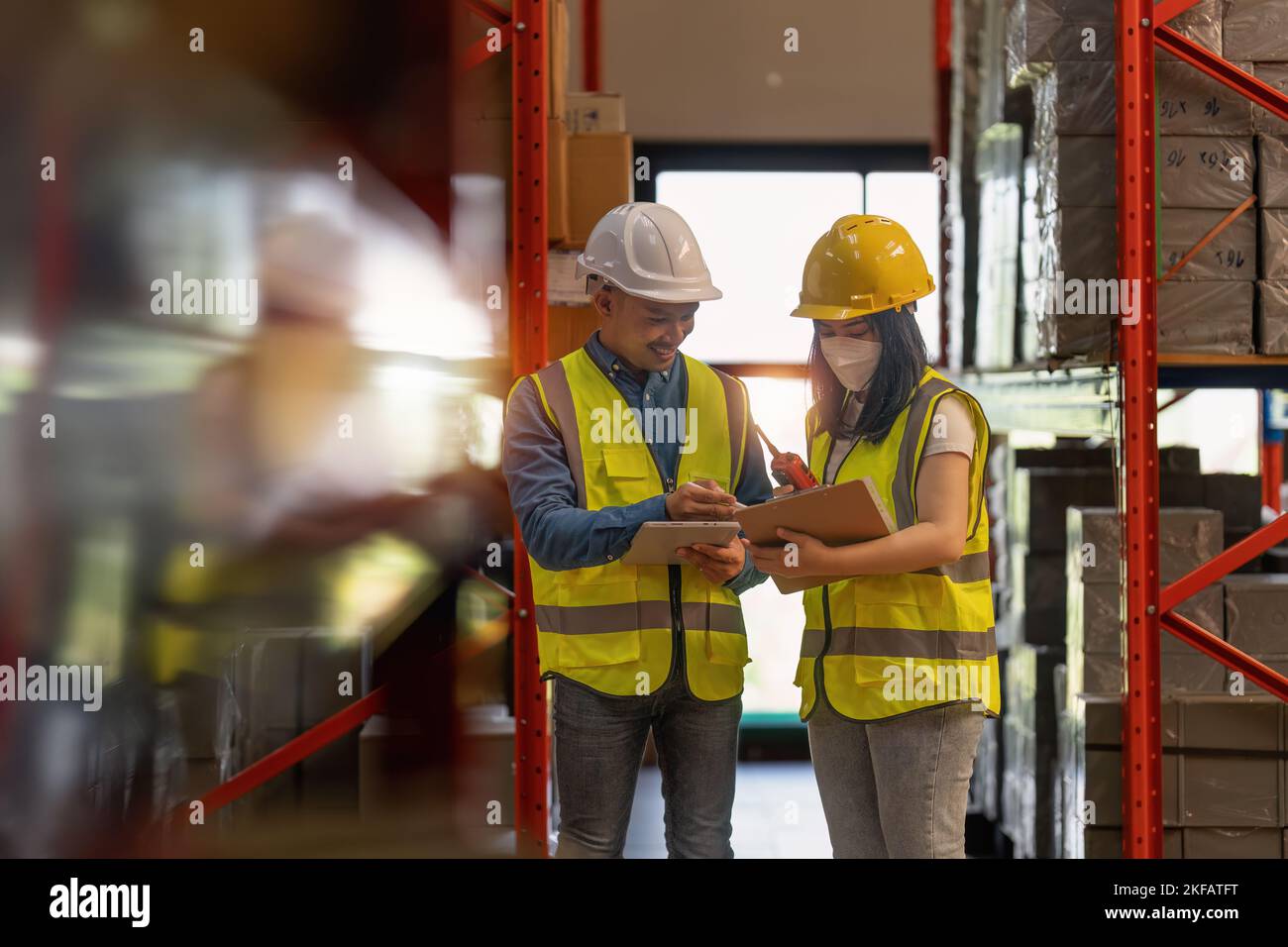 Working at warehouse. Male warehouse worker checking in storage
