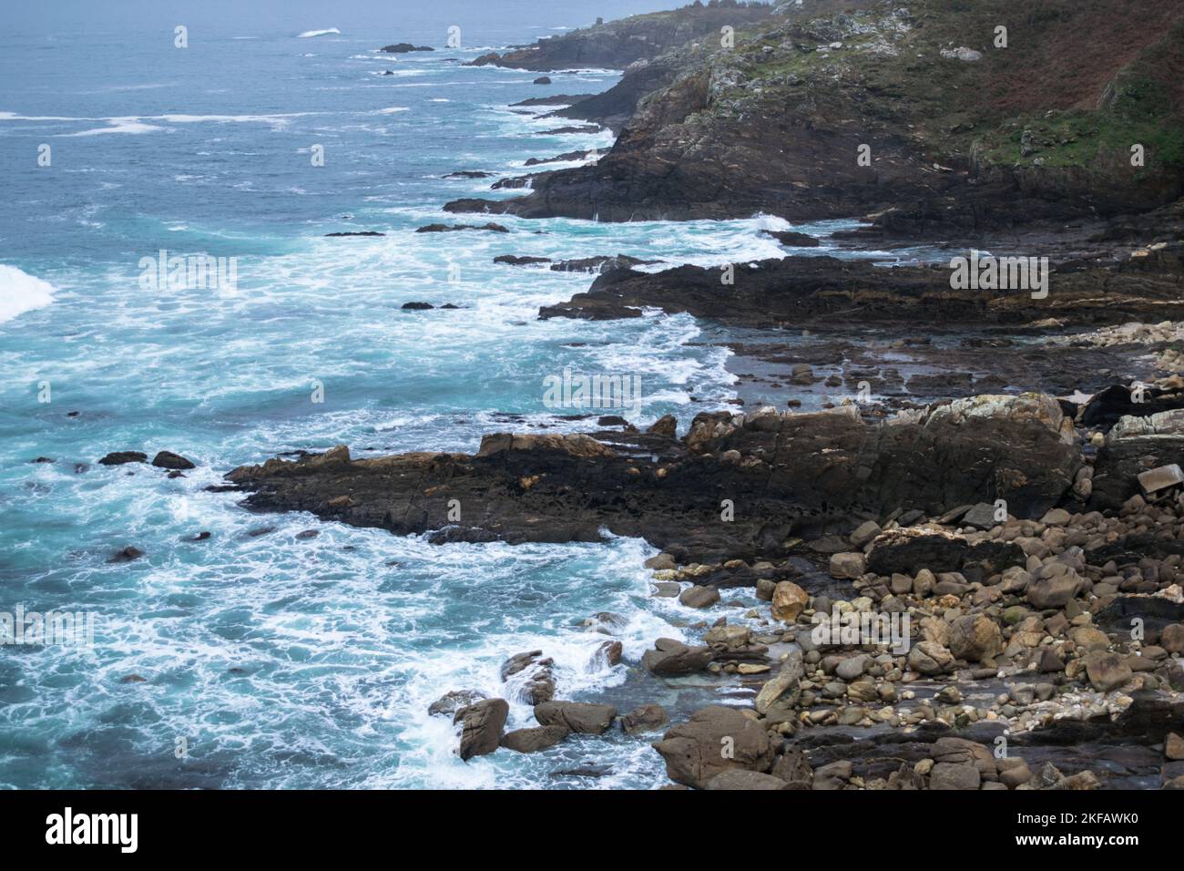 sea crashing against the rocks of the coast Stock Photo