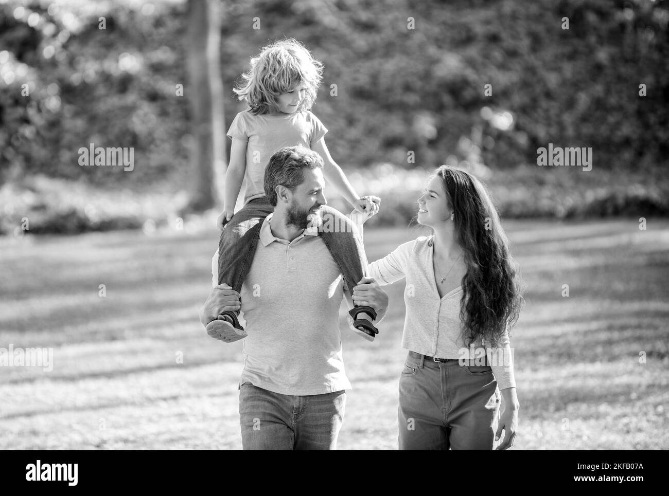 Parenthood requires love. Parents and child on summer outdoors. Foster parents and son Stock Photo