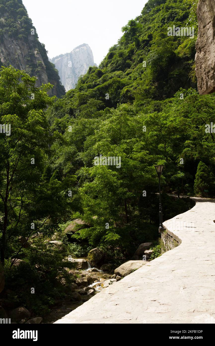 Huashan Yu (Huashan Gorge) seen after departing from the Yuquanyuan Temple (west gate entrance). Views and landscape scene from the hiking trail path to the five peaks of  Huashan Mountain / Mount Hua / Mt Hua near Huayin, Weinan, China 714299 (125) Stock Photo