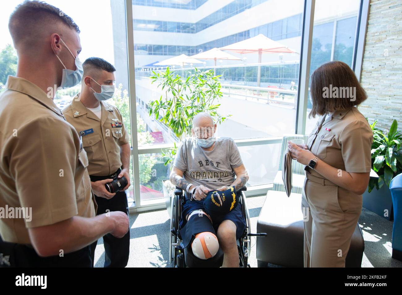 Sailors assigned to USS Gerald R. Ford (CVN 78) speak with Navy veteran Kenneth Sooy during a visit to the Mary Free Bed Rehabilitation Hospital in Grand Rapids, Michigan, during a namesake visit, September 1, 2022. Twelve Ford Sailors traveled to Michigan for the ship’s annual namesake visit to learn about the legacy of former President Gerald R. Ford and connect with local community members in Grand Rapids, Ann Arbor and Albion, Michigan. Stock Photo