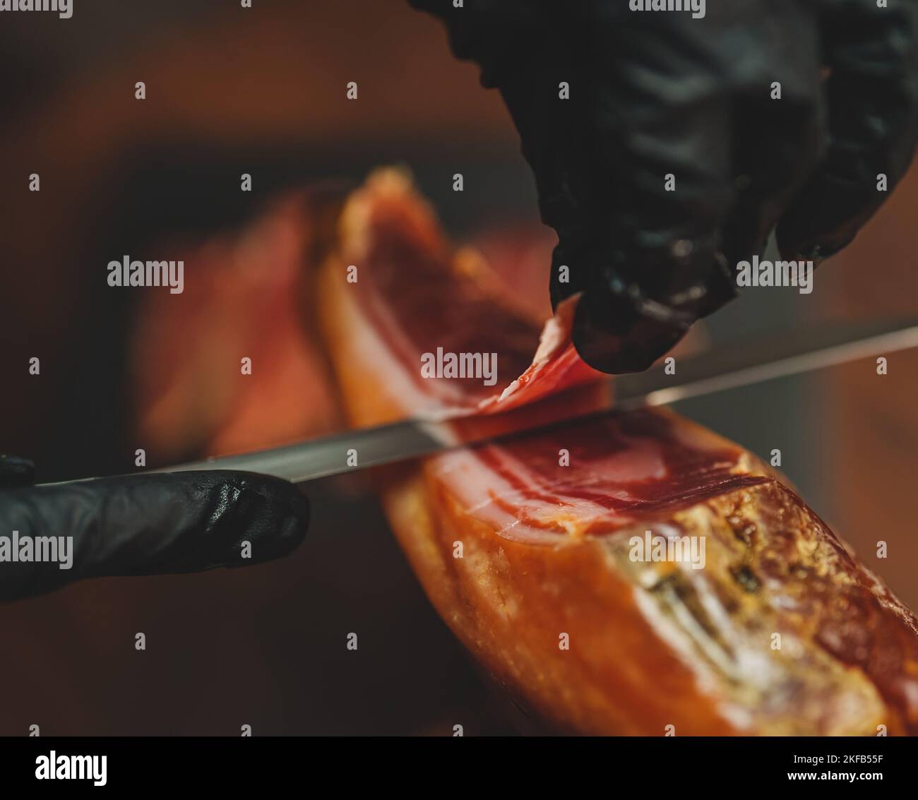 Chef cutting drycured spanish ham Jamon Stock Photo Alamy