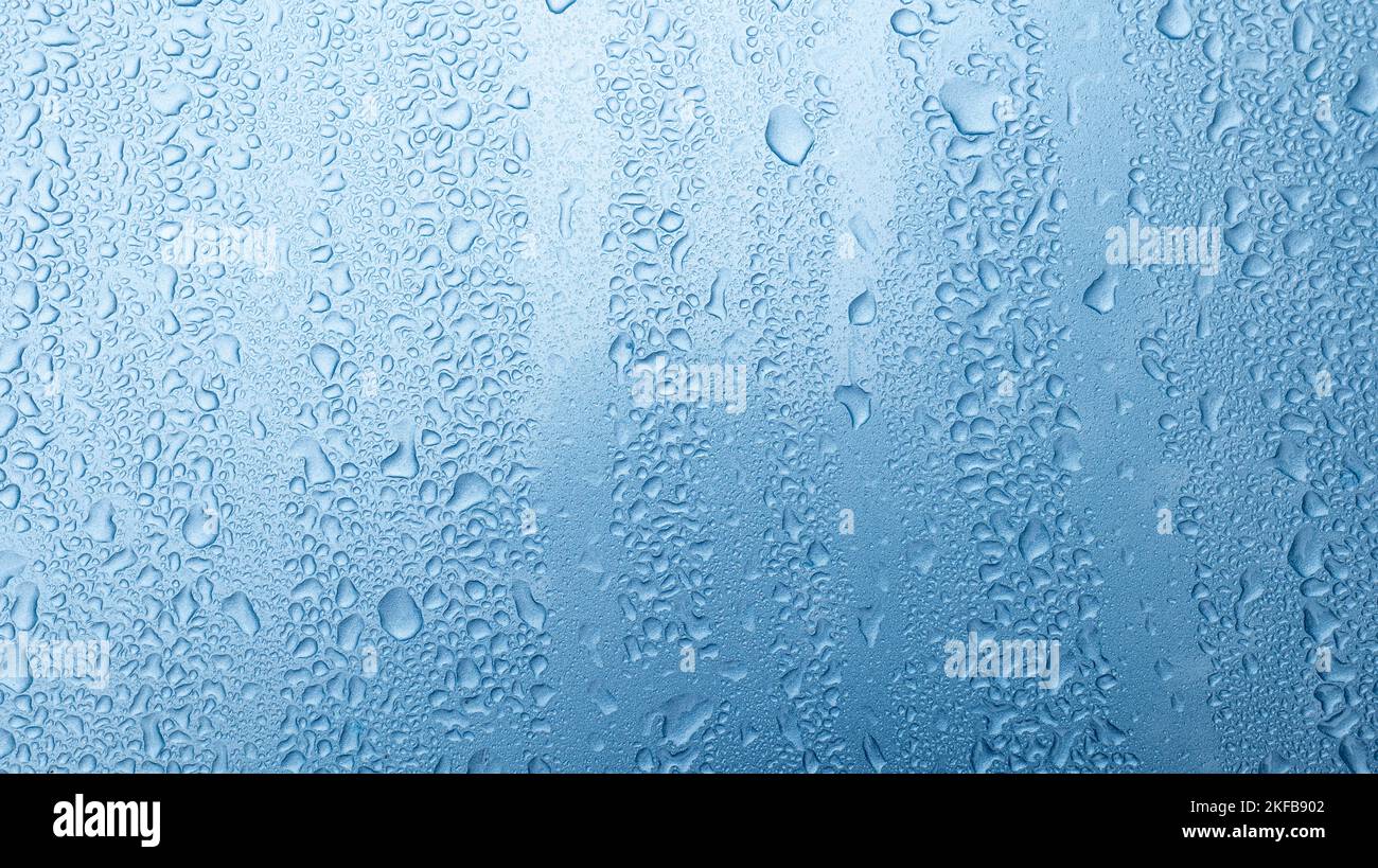 Water Drops On Blue Background. Stock Photo