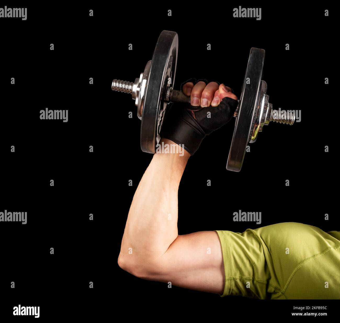 Strong arm hand lifting dumbbell close up. Pumping, sport concept. High quality photo Stock Photo
