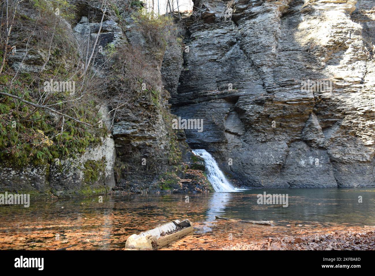 The beautiful Mike Kill waterfall flowing down the rocks into a serene ...