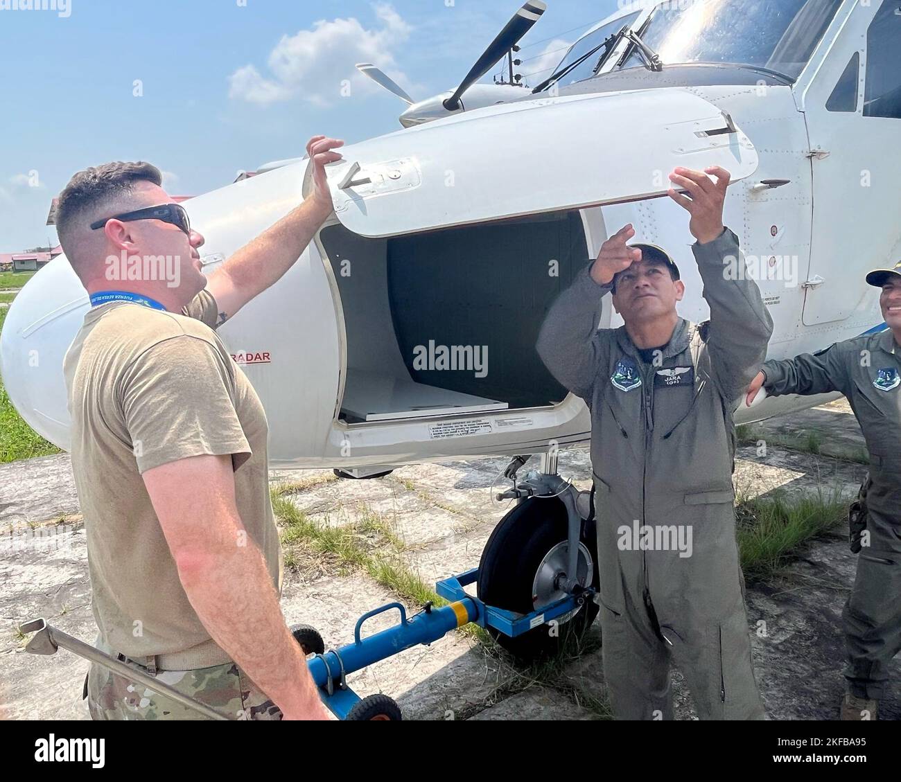 Tech. Sgt. Jacob Haines, left, a 571st Mobility Support Advisory Squadron advisor, inspects a DHC-6 Twin Otter aircraft with Fuerza Aérea de Peru’s Técnico Segundo Aldo Otrilla-Jara, right, a Grupo Aereo N. 42 DHC-6 maintainer, Sept. 1, 2022, in Base Area Coronel Francisco Secada Vignetta Air Base, Peru. The DHC-6 Twin Otter aircraft was a focal point during the out-in-the-field training between the two air force military service organizations. Stock Photo