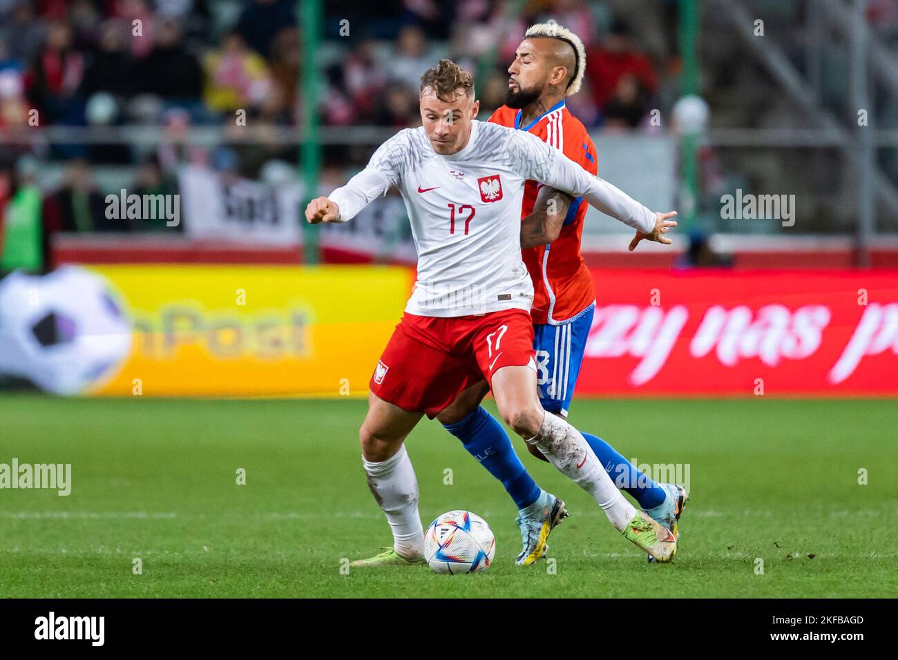 Warsaw, Poland. 16th Nov, 2022. Szymon Zurkowski (L) of Poland and Arturo Vidal (R) of Chile in action during the friendly match between Poland and Chile at Marshal Jozef Pilsudski Legia Warsaw Municipal Stadium. Final score; Poland 1:0 Chile. (Photo by Mikolaj Barbanell/SOPA Images/Sipa USA) Credit: Sipa USA/Alamy Live News Stock Photo