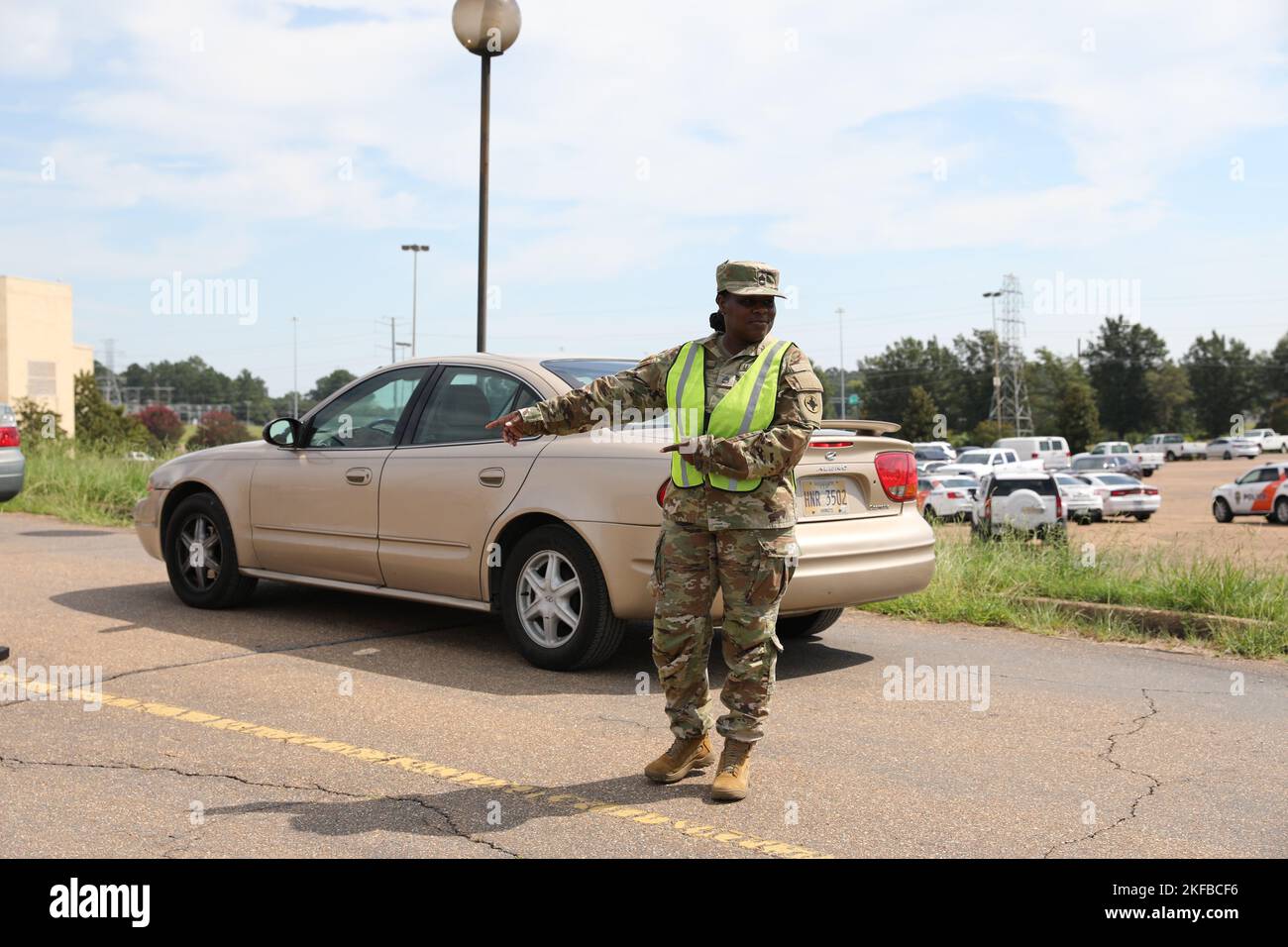 A Mississippi National Guard Soldier directs traffic at the Metrocenter