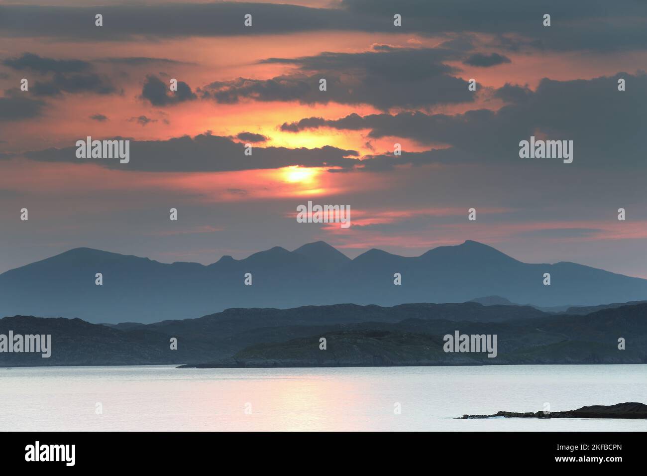 The View across Enard Bay to the Misty Mountains of Assynt and Inverpolly just after Sunrise, Coigach Peninsula, Assynt, Highlands, Scotland, UK Stock Photo