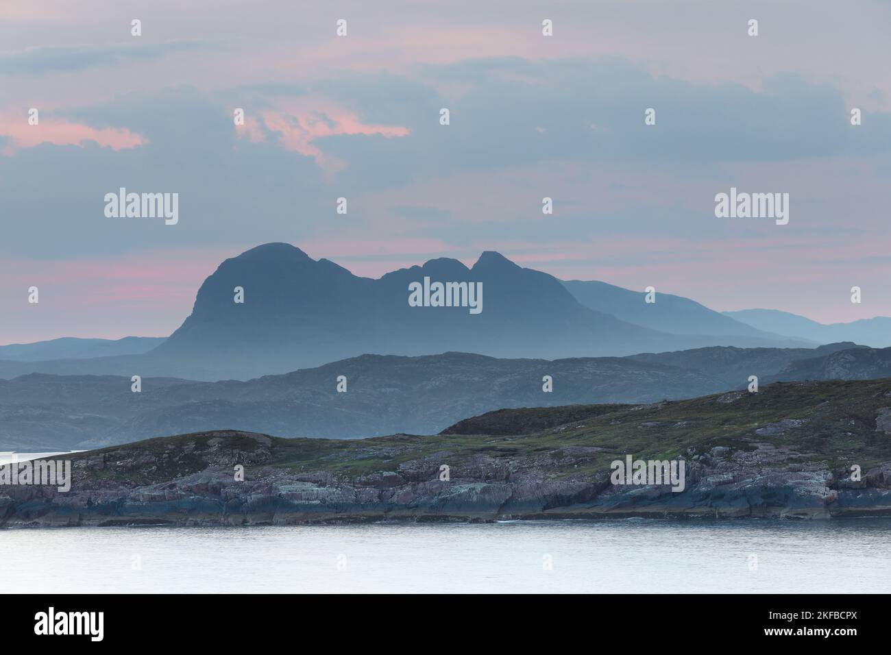 Suilven viewed across Enard Bay from Achnahaird Bay in pre-dawn light on a misty morning, Coigach Peninsula, Assynt, Highlands, Scotland, UK Stock Photo