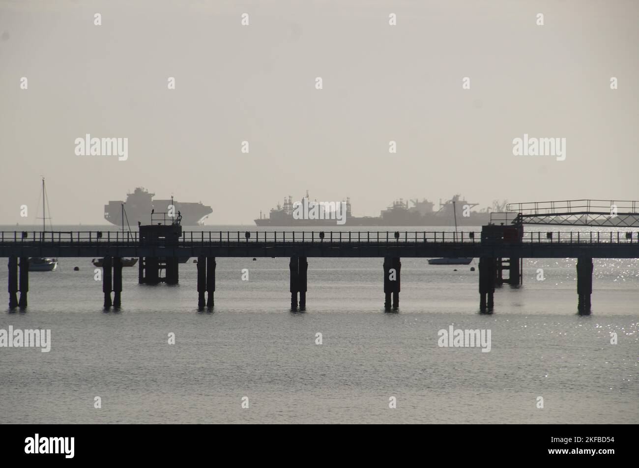 A silhouette of a bridge in a port on a foggy day Stock Photo - Alamy