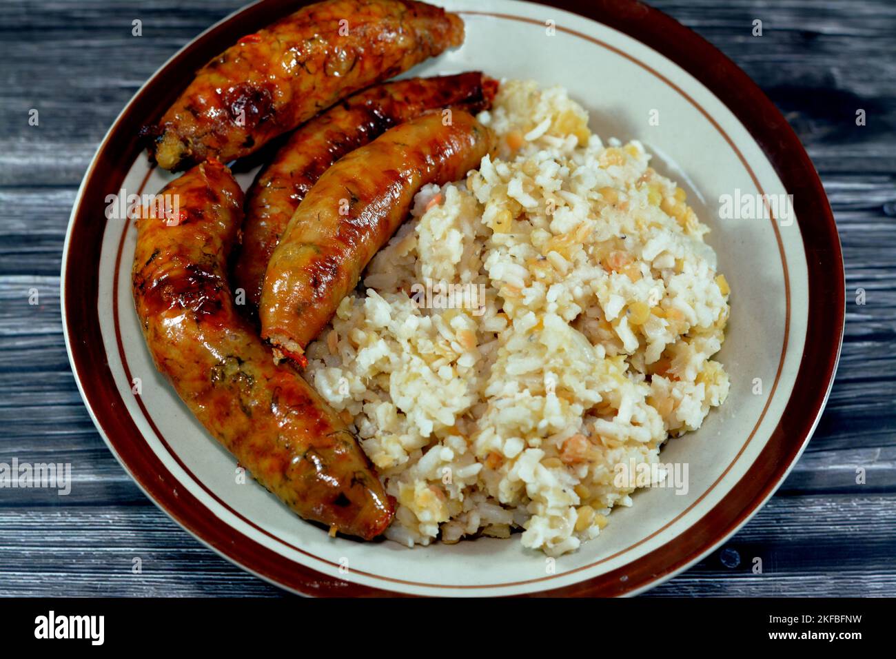 Egyptian hot steamed white rice with yellow lentils Koshary and deep