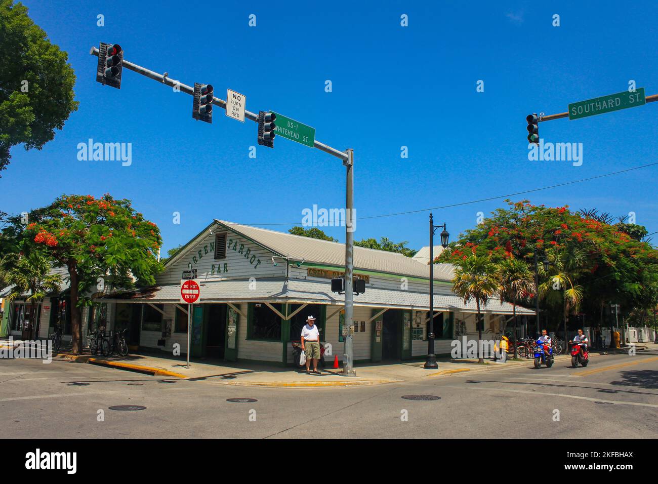 Famouse Green Parrot Bar with tourist standing on corner and others on