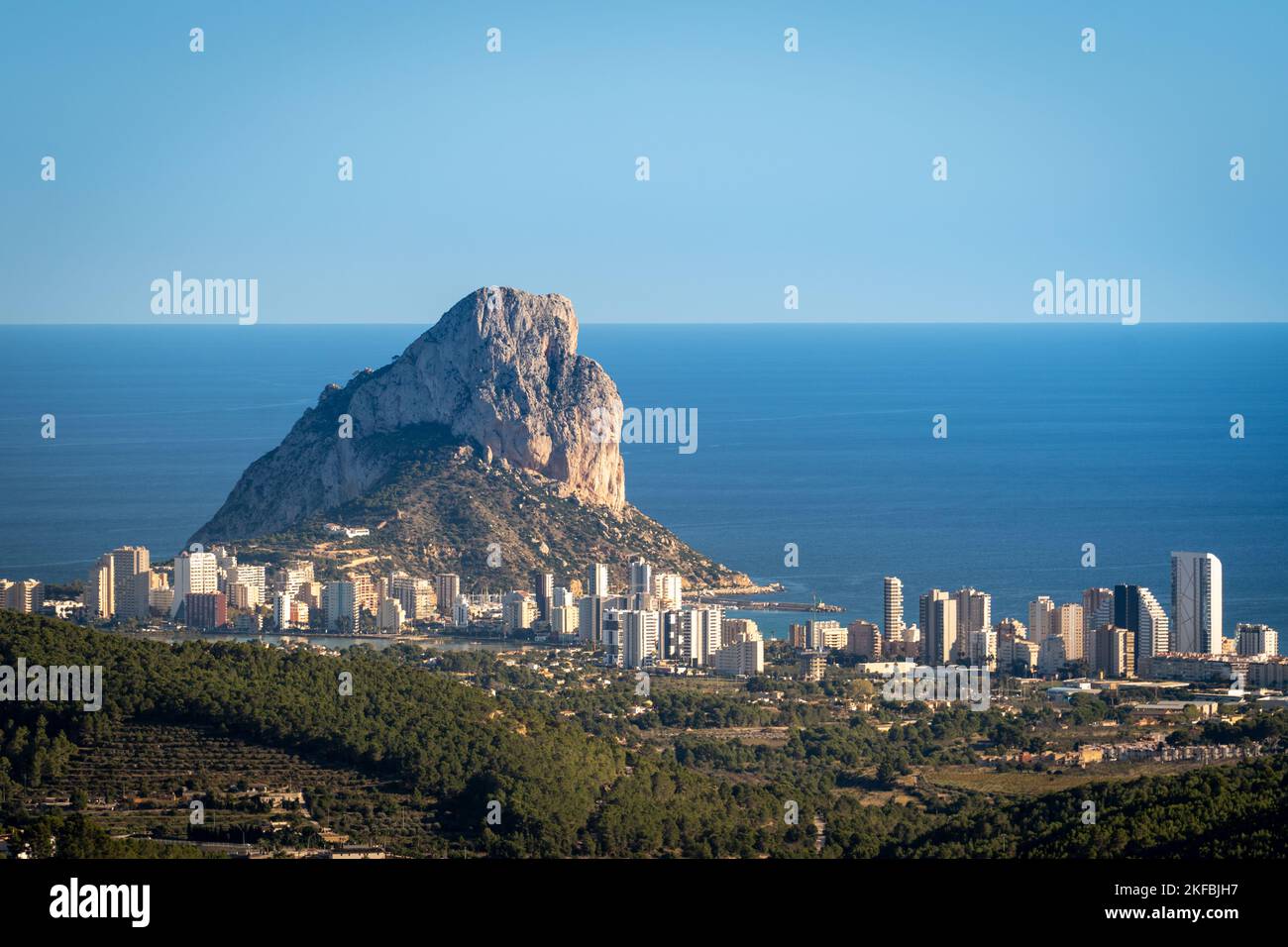 View of the Ifach rock and Calpe from afar Stock Photo