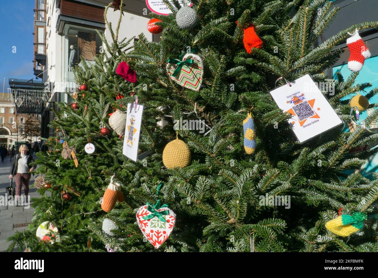 Exeter, UK, 17 November 2022: In the Princesshay shopping precinct in the heart of Exeter a display of Christmas trees doubles up as a fundraising appeal for national and local charities. As the cost of living crisis, high inflation and economic recession affect the country, charities will be called on to do more but may not get the donations they need to provide all the help needed. Anna Watson/Alamy Live News Stock Photo