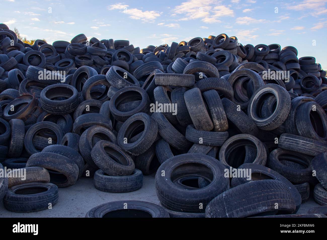 Landfill with old tires and tires for recycling. Reuse of waste rubber