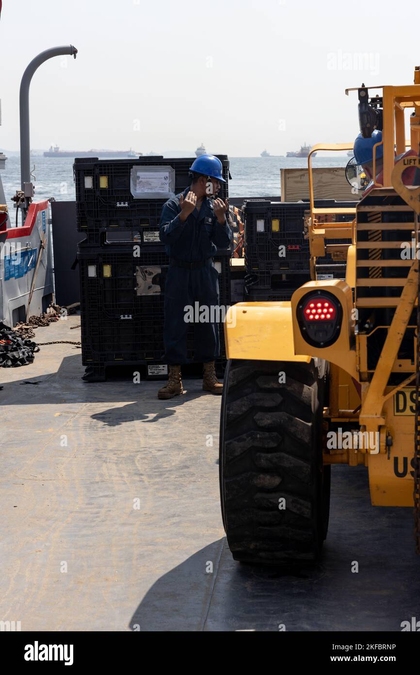 U.S. Navy Boatswains Mate 3rd Class Kinziano Kerai, assigned to Landing Craft, Utility 1663, guides a forklift carrying U.S. Marine Corps equipment loaded from the amphibious transport dock ship USS Mesa Verde (LPD 19) in Rio de Janeiro in support of Special Purpose Marine Air-Ground Task Force UNITAS LXIII, Sept. 3, 2022. Marines and their equipment are moving ashore from the Mesa Verde to begin training during UNITAS LXIII.  UNITAS is the world’s longest-running annual multinational maritime exercise that focuses on enhancing interoperability among multiple nations and joint forces during li Stock Photo
