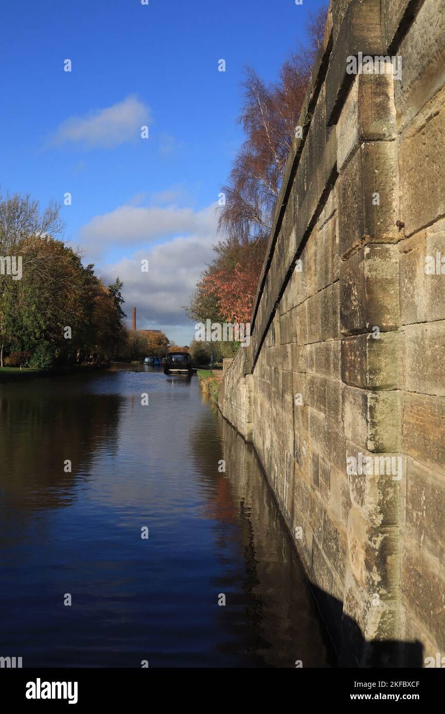 View from alongside the bridge over the Rufford arm of the Leeds and Liverpool canal looking towards the former Ainscough’s flour mill in Burscough. Stock Photo
