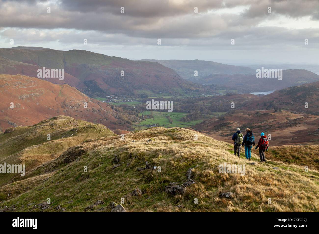 Walkers heading down from Tarn Crag towards Grasmere, Lake District