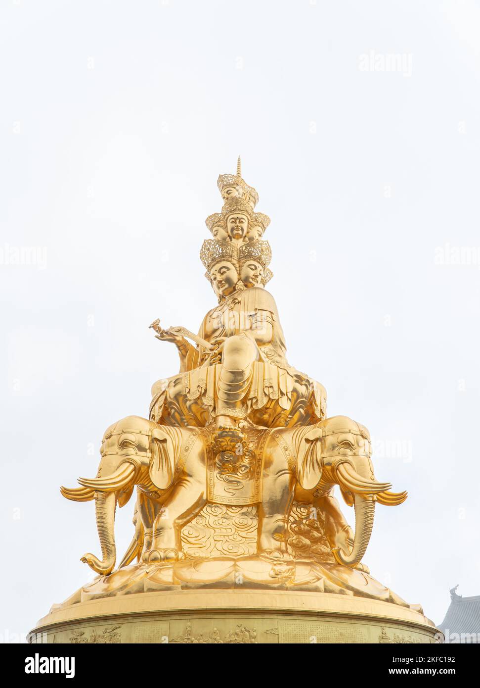 A vertical shot of the golden Buddha statue against the sky Stock Photo ...