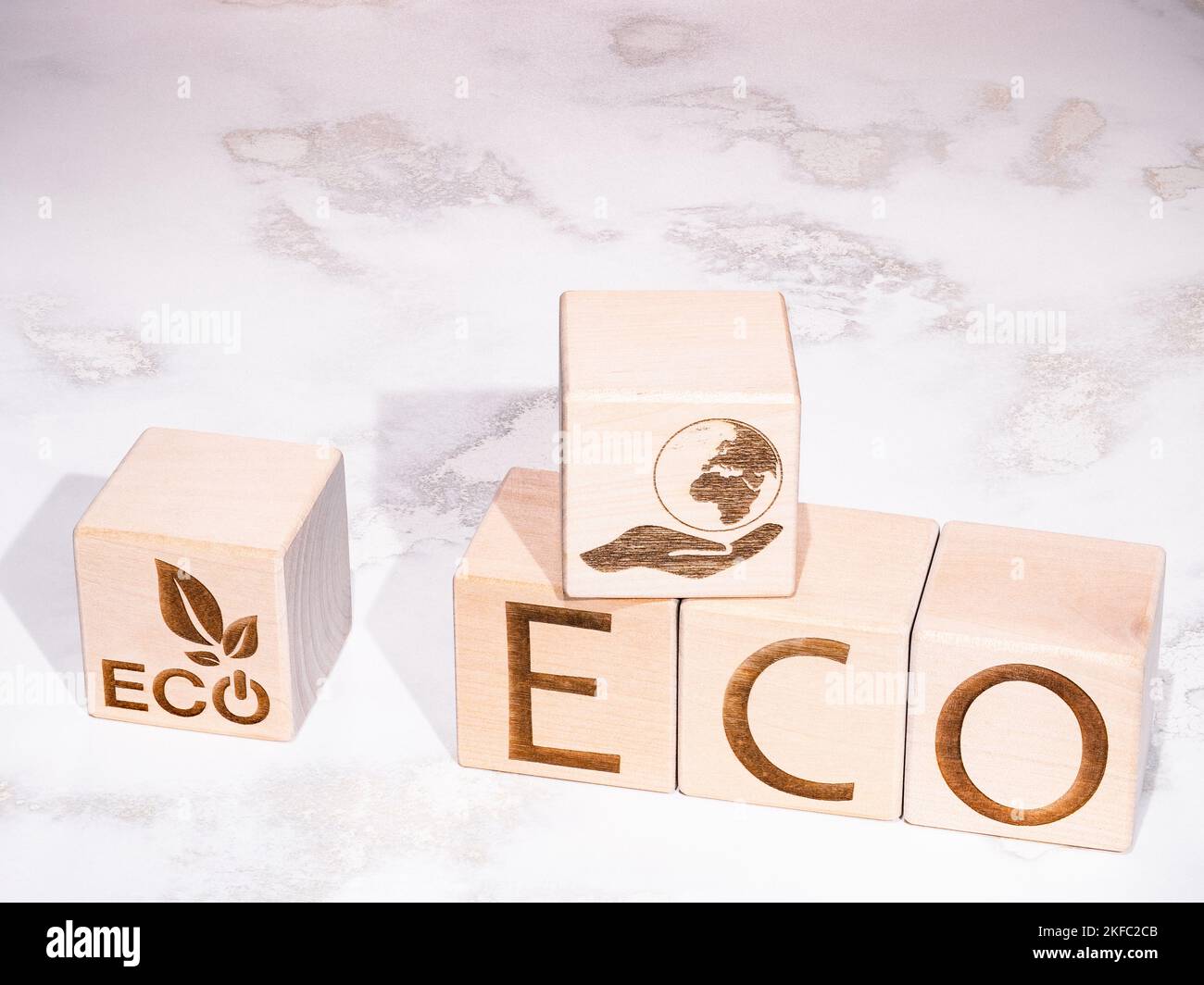ECO text on wooden cubes as an environmental support concept Stock Photo