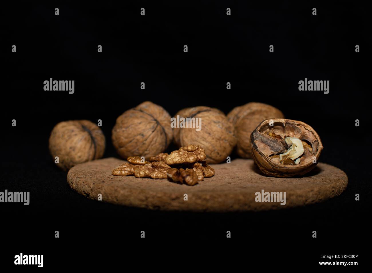Walnuts on a black matte background. Stock Photo
