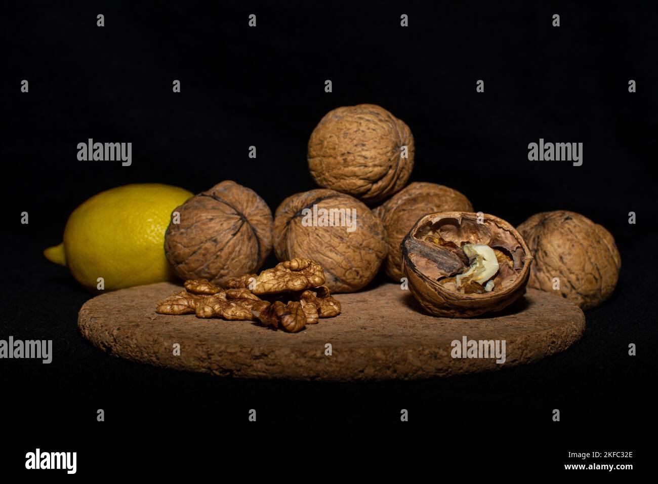 Walnuts on a black matte background. Stock Photo