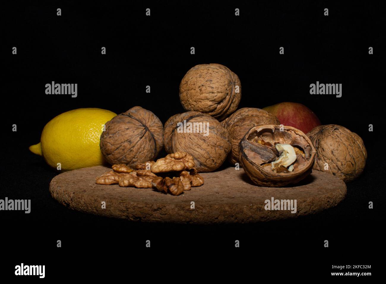 Walnuts on a black matte background. Stock Photo