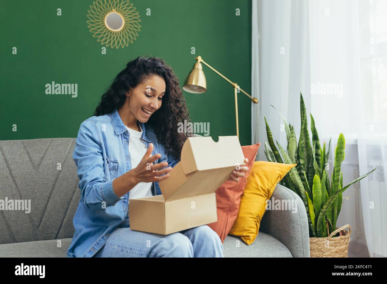 A young Latin American woman received a pleasant parcel delivered by