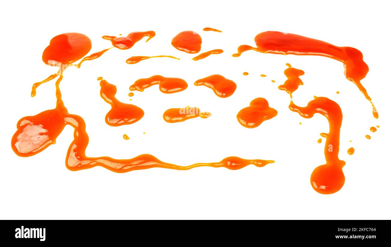 Orange sauce splashes isolated on white a background. Top view. Stock Photo