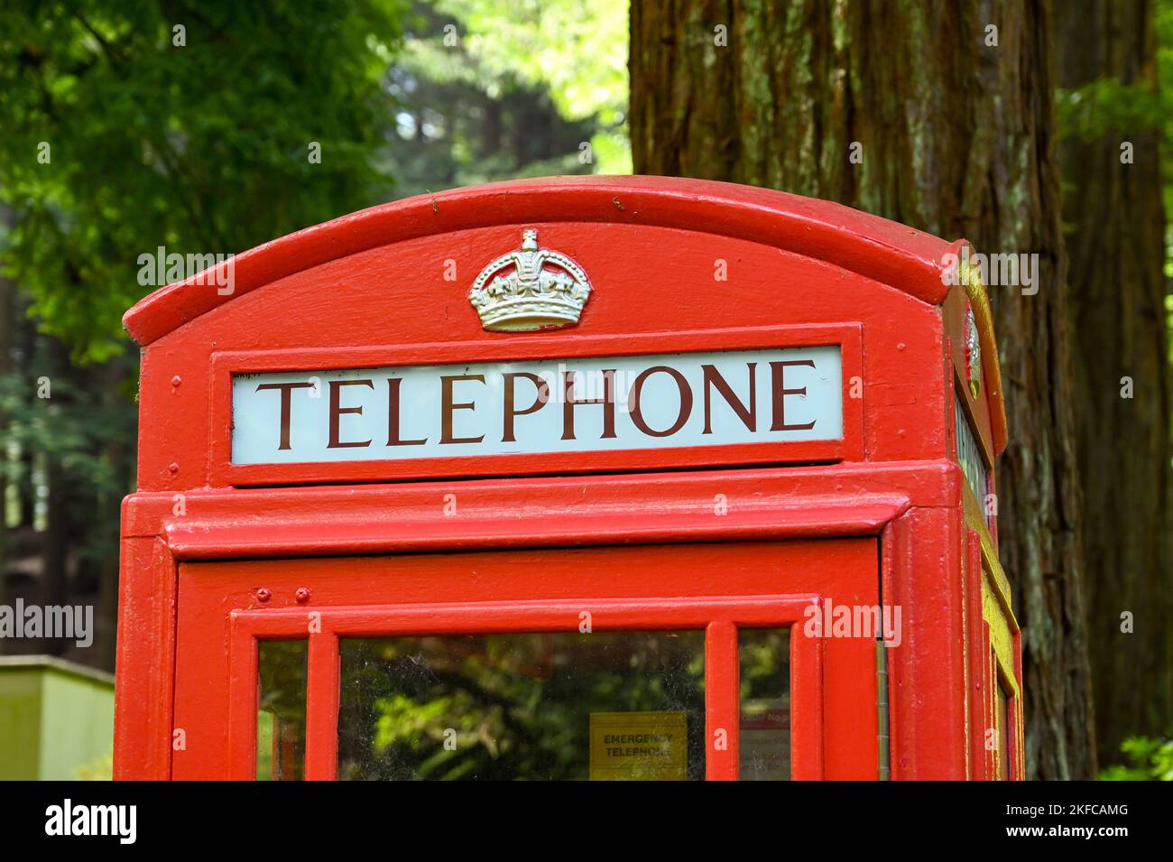 Warminster, England - May 2022: Close up view of the sign on a vintage red Post Office telephone box. No people. Stock Photo