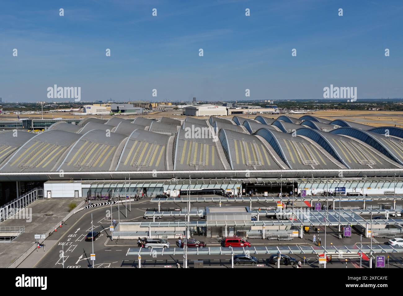 London, England - August 2022: Aerial view of the drop off zone and entrance to Terminal 2, The Queen's Terminal, at London Heathrow airport Stock Photo