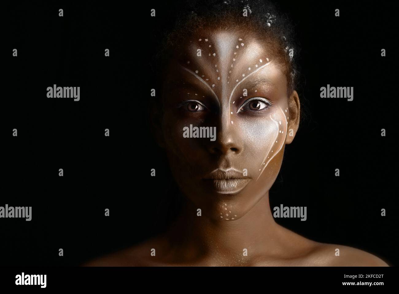 Art photo of Africal woman with tribal ethnic paintings on her face Stock Photo