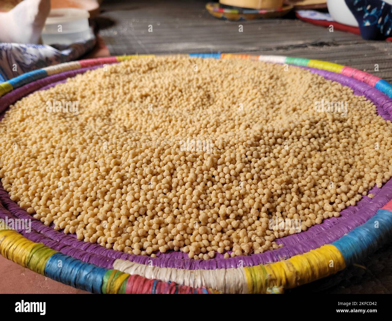 Handrolled couscous being handmade by the Coop from village whole wheat flour in Ain Nafad