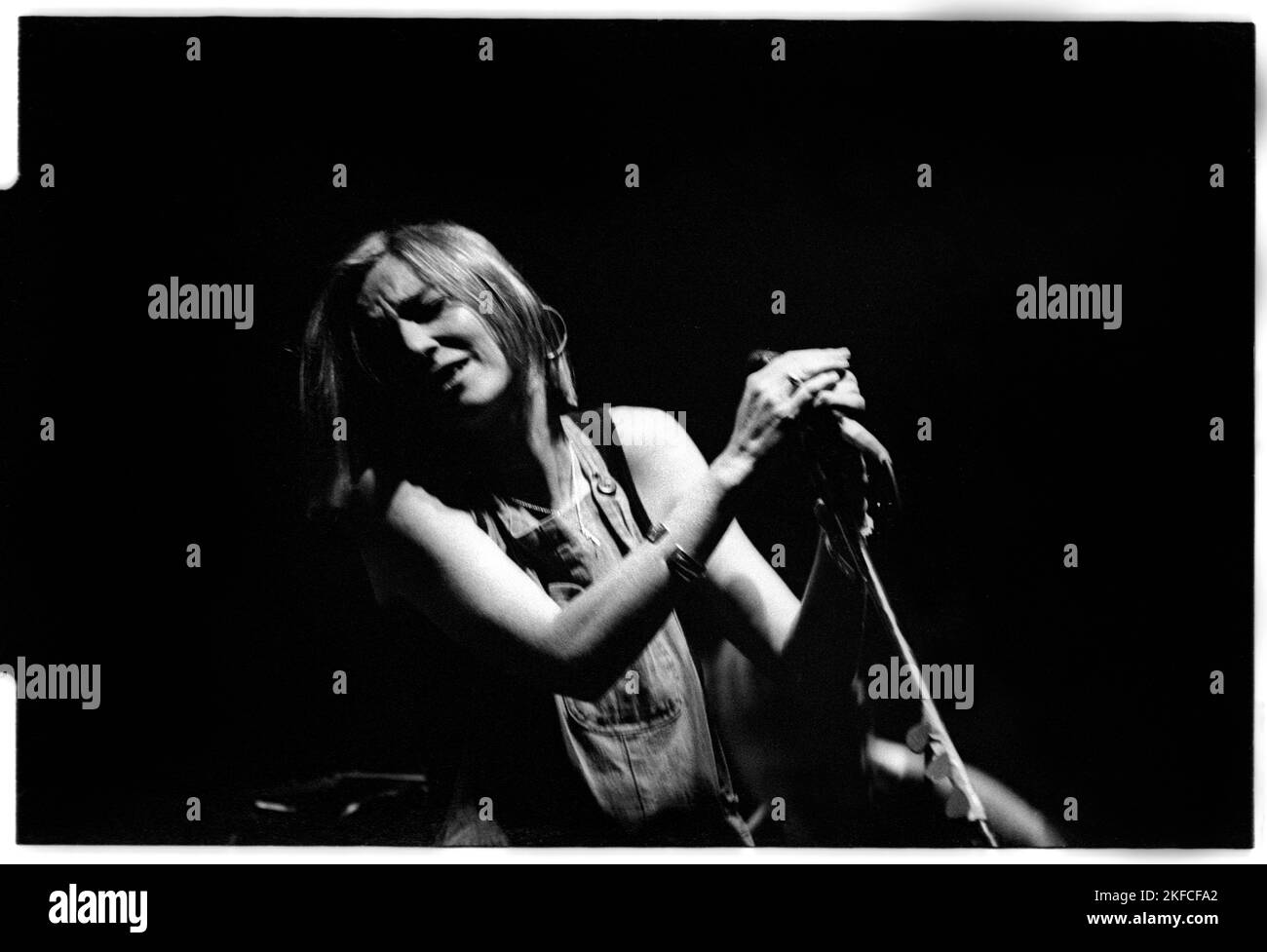 PORTISHEAD, GLASTONBURY FESTIVAL, 1995: Beth Gibbons of Portishead live on the Acoustic Stage at the Glastonbury Festival, England, June 24, 1995. This infamous performance went ahead in a massively overfull tent after a near riot that led to the previous act Evan Dando being bottled off stage. Photograph: Rob Watkins.   Portishead, a British trip-hop band formed in 1991, redefined electronic music with their dark, atmospheric sound. Albums like 'Dummy' and 'Portishead' showcased their haunting melodies and Beth Gibbons' emotive vocals, cementing their status as pioneers of the genre. Stock Photo