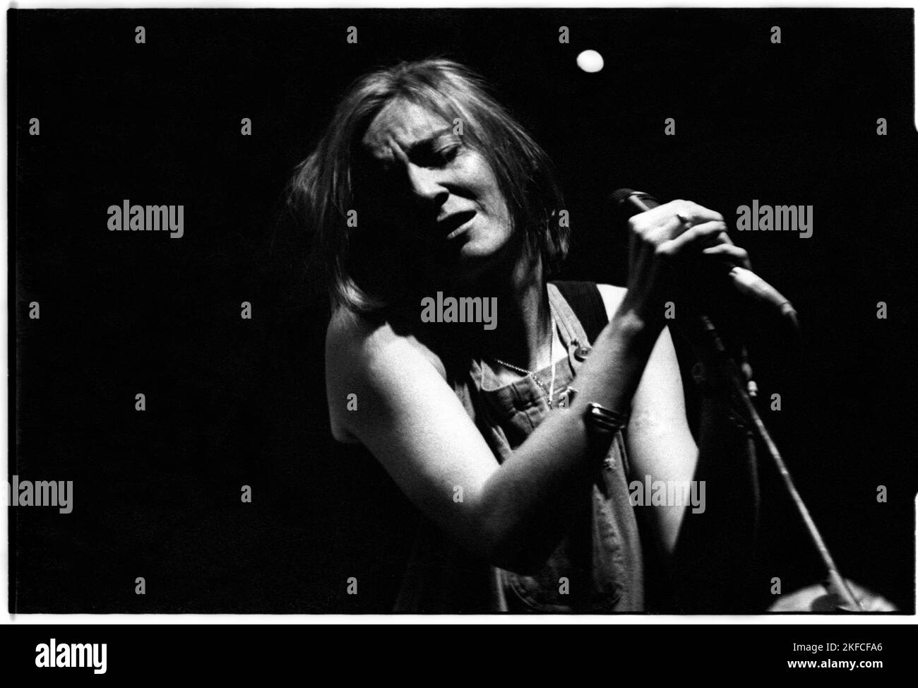 PORTISHEAD, GLASTONBURY FESTIVAL, 1995: Beth Gibbons of Portishead live on the Acoustic Stage at the Glastonbury Festival, England, June 24, 1995. This infamous performance went ahead in a massively overfull tent after a near riot that led to the previous act Evan Dando being bottled off stage. Photograph: Rob Watkins.   Portishead, a British trip-hop band formed in 1991, redefined electronic music with their dark, atmospheric sound. Albums like 'Dummy' and 'Portishead' showcased their haunting melodies and Beth Gibbons' emotive vocals, cementing their status as pioneers of the genre. Stock Photo