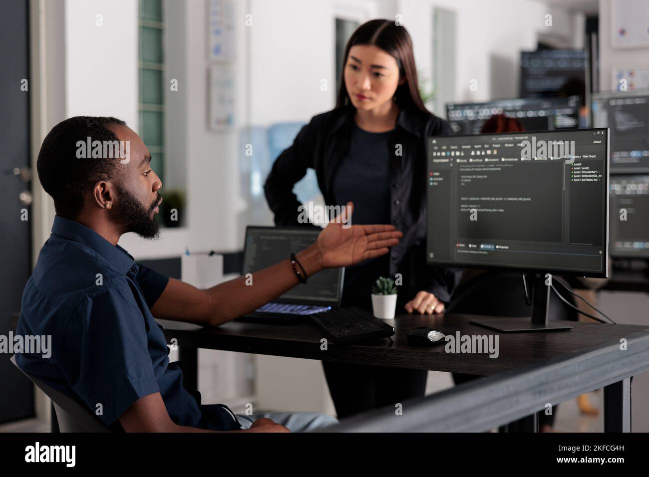 Diverse team of software developer developing html code and cloud ...
