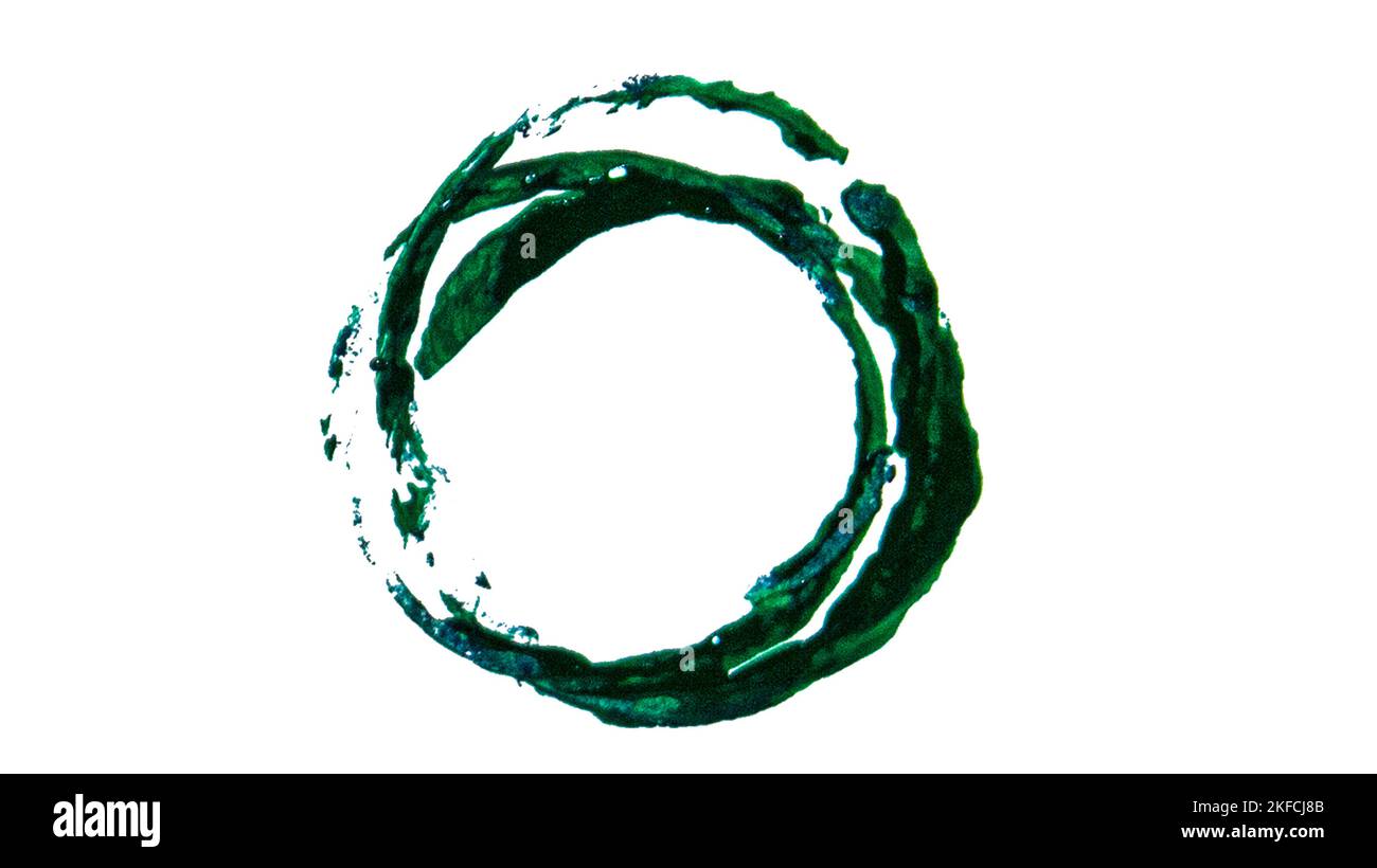 round uneven imprint of green paint on a white background. Stock Photo