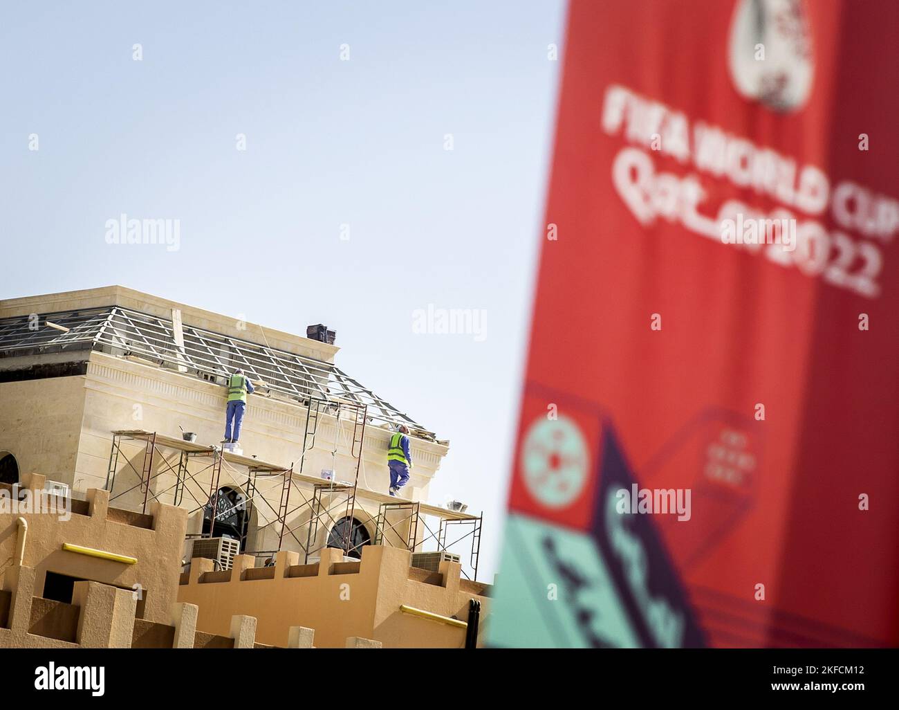 DOHA - Workers at work in Doha. Qatar is awaiting the FIFA World Cup ...