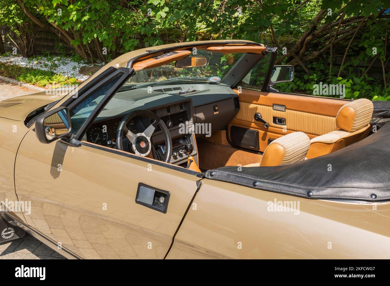 1980 midas-gold convertible Triumph TR8 with view of interior. Stock Photo
