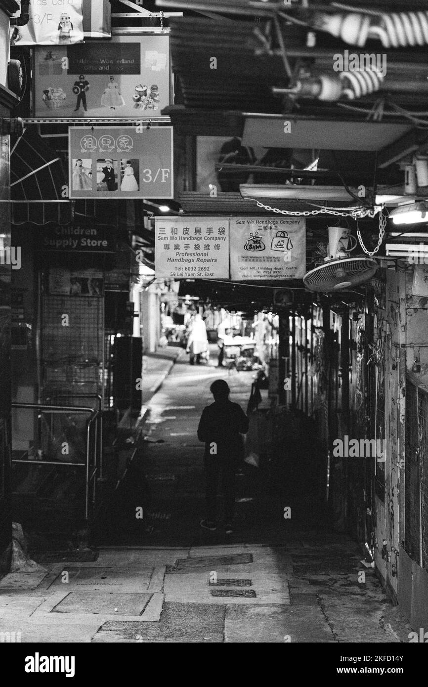 The Hong Kong Central Street at night with a man walking Stock Photo Alamy