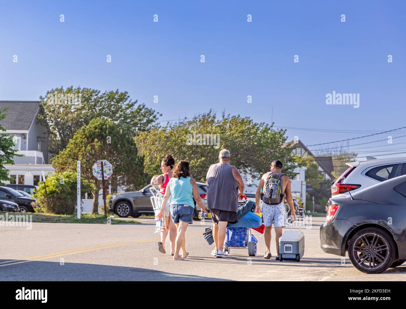 group of four returning from an ocean beach in montauk Stock Photo