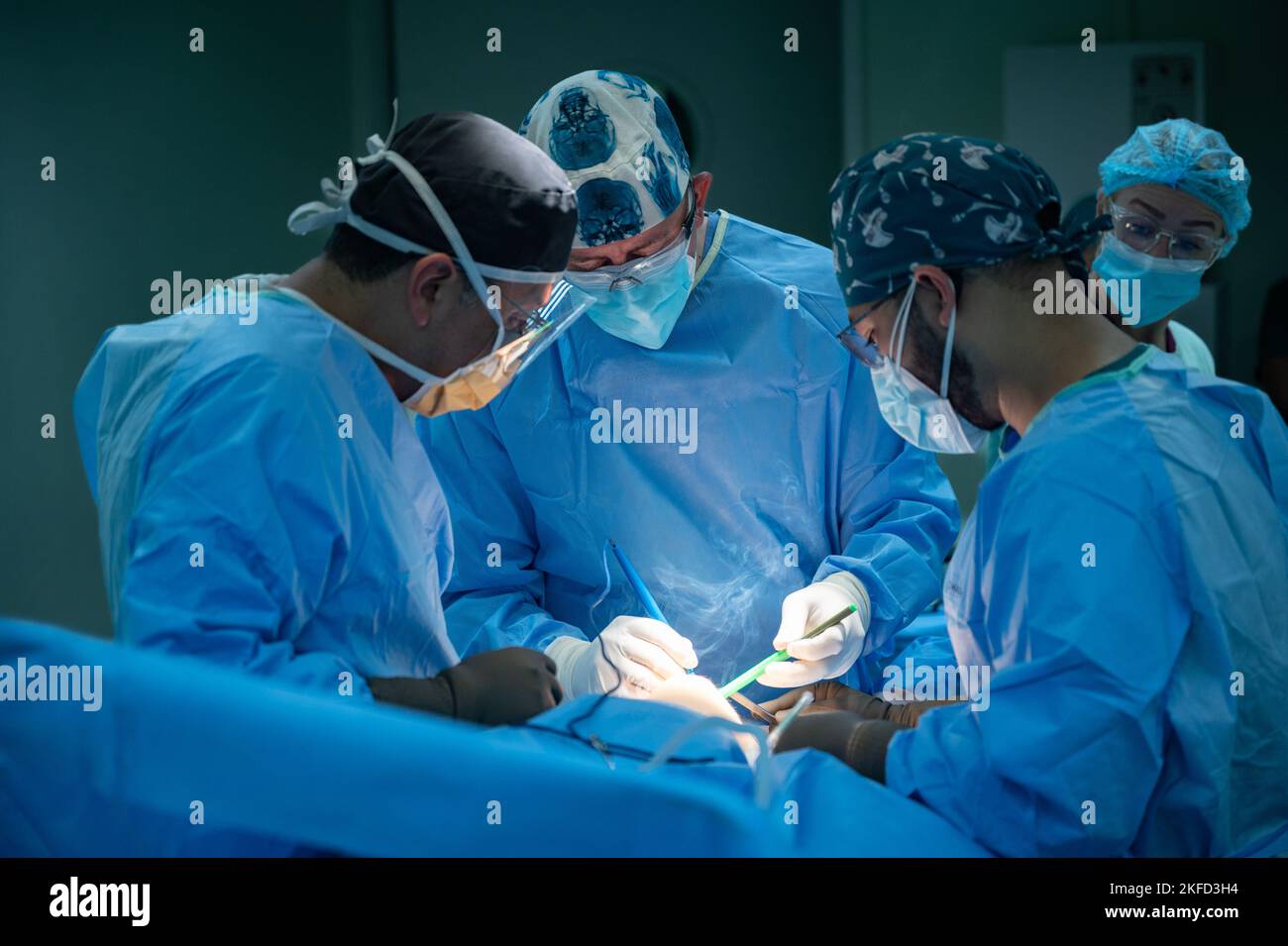 U.S. Air Force Lt. Col. Jacob Riis, center, an orthopedic surgeon