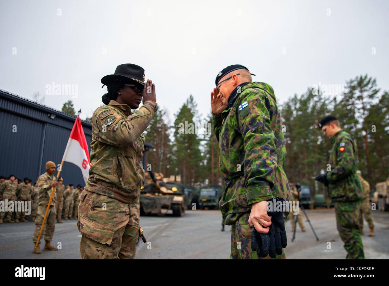 Niinisalo, Finland. 5th Nov, 2022. Col. Rainer Kuosmanen, commander of the Finnish Armored Brigade, salutes U.S. Capt. Anna Jones, a troop commander with 6th Squadron, 9th Cavalry Regiment, 3rd Armored Brigade Combat Team, 1st Cavalry Division (3-1 ABCT), operationally assigned to the 1st Infantry Division (1 ID), after presenting her with a traditional Finnish knife honoring her work during Hammer 22, an annual combined forces exercise conducted by and alongside Finland's Army Headquarters, Armored Brigade, Pori Brigade, Karelia Brigade, Uti Jaeger Regiment and Logistics Department of Stock Photo