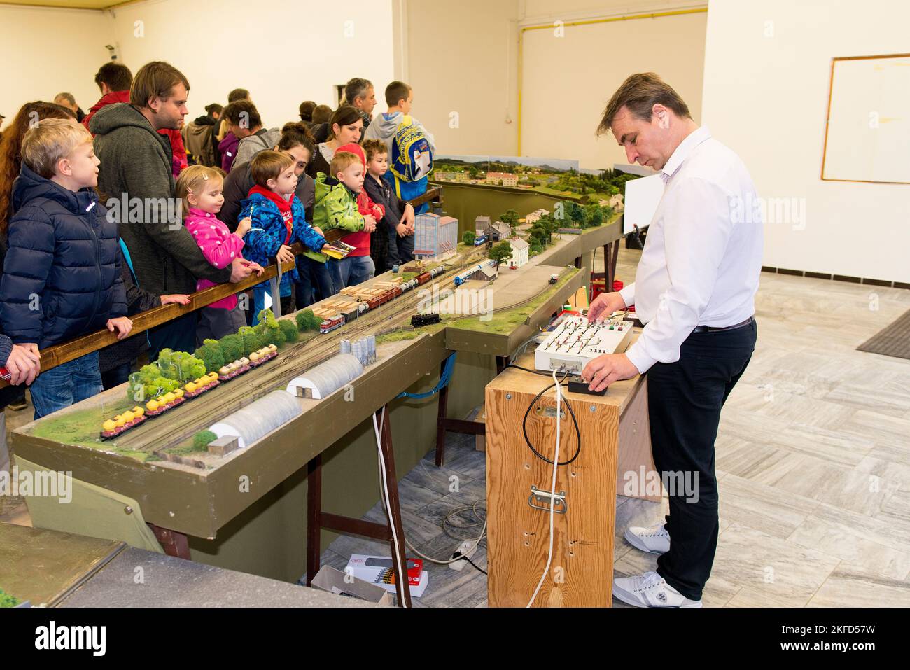 A model train exhibition operator presenting for kids and parents ...