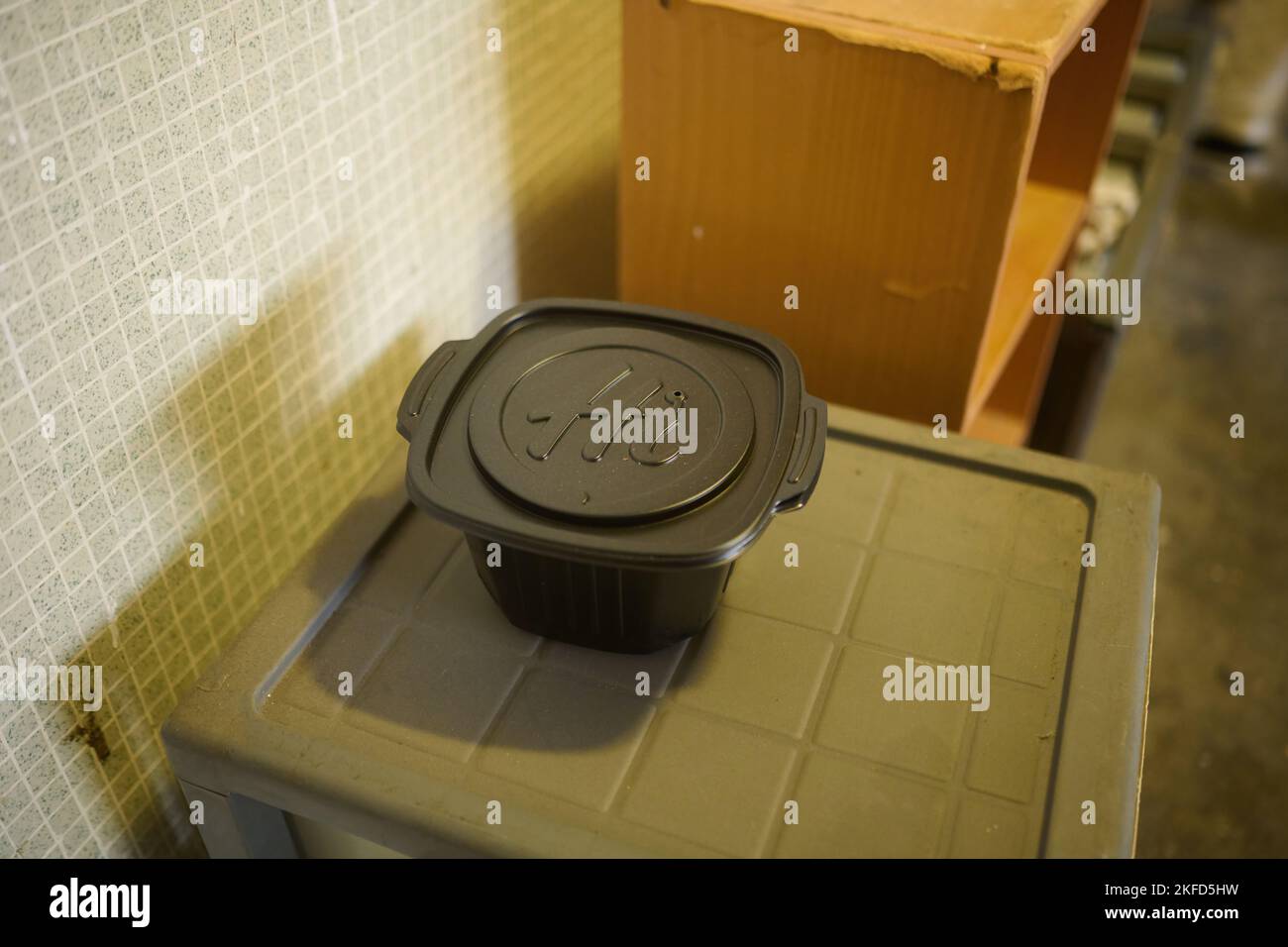 Selfheating hot pot in the hallway of an old public housing complex in Hong Kong Stock Photo