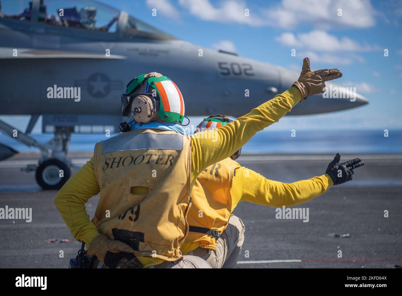 October 24, 2022, At Sea - Two shooters launch an E/A-18G Growler, from the Cougars of Electronic Attack Squadron (VAQ) 139, aboard the aircraft carrier USS Nimitz (CVN 68). Nimitz Carrier Strike Group is underway preparing for an upcoming deployment. (Credit Image: © U.S. Navy/ZUMA Press Wire Service/ZUMAPRESS.com) Stock Photo